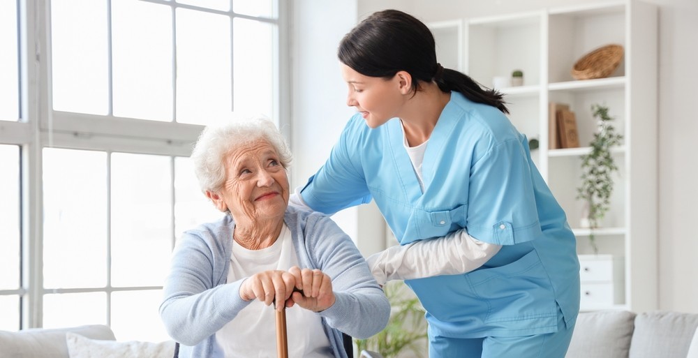 A healthcare specialist looking after an elderly woman