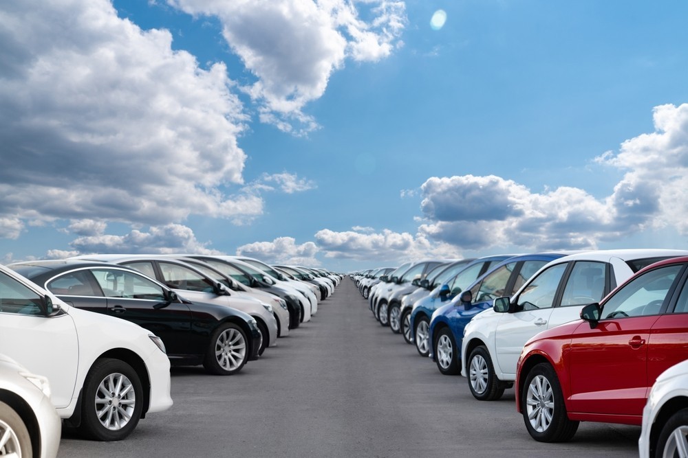 A fleet of cars parked up on two sides