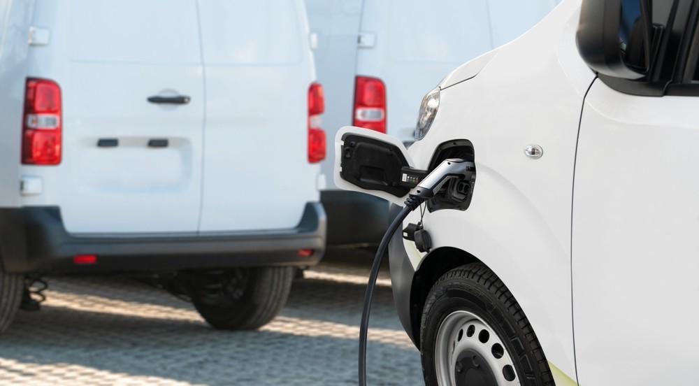 An electric van being recharged at a charging point