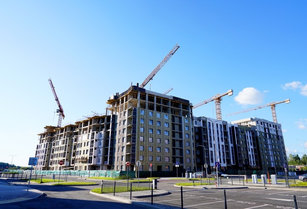 Cranes on a building site constructing residential properties