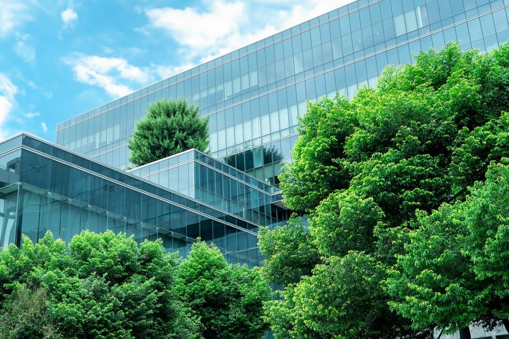 Photo of a new office block with trees around it