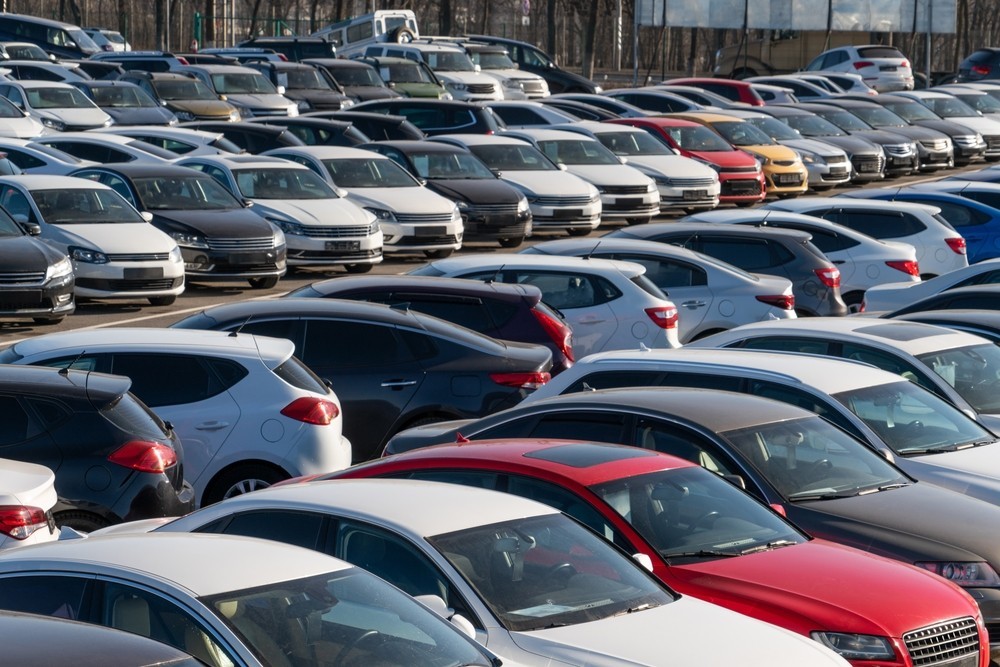 A forecourt of parked cars