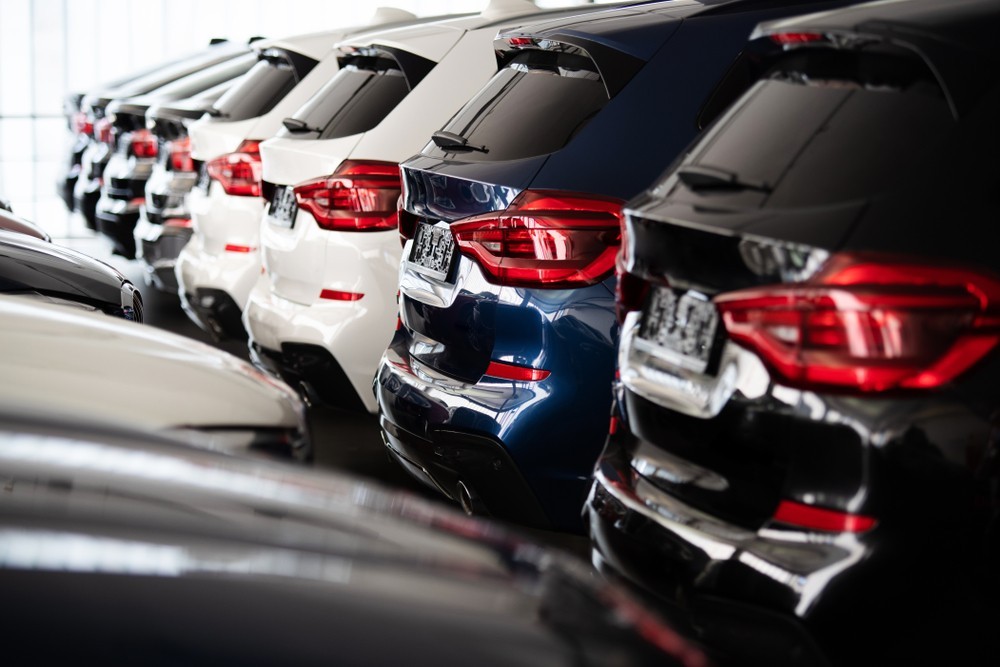 Boot of multiple cars parked in a dealership