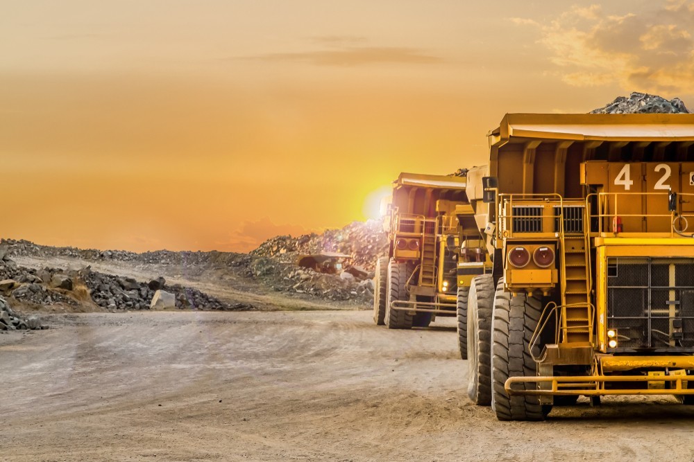 Photo of two dump trucks