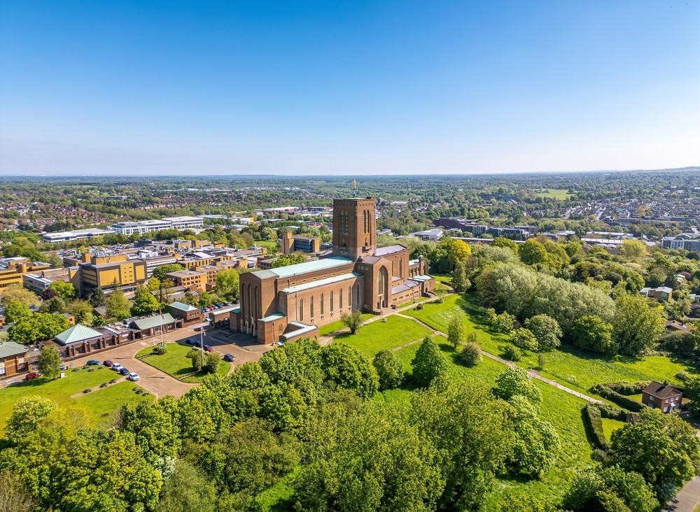 Aerial photo of Guildford Cathedral Church with blue sky in the background
