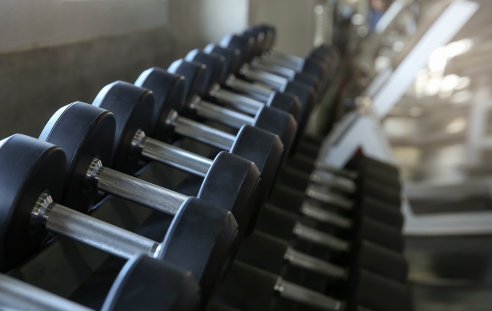 A row of dumbbells in a gym