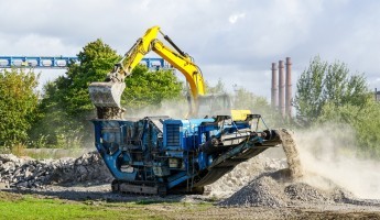 A mobile waste shredder on a construction site