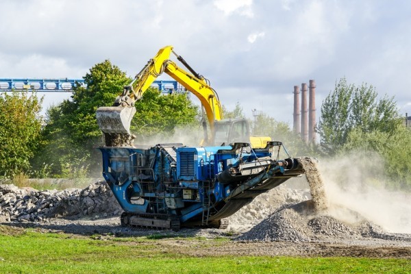 A mobile waste shredder on a construction site