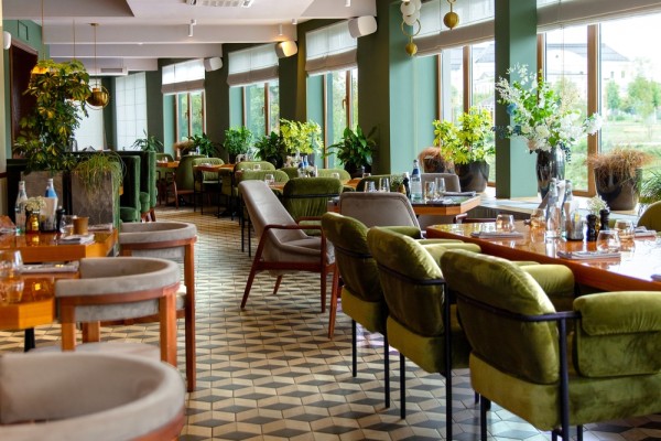 The interior of a restaurant with tables and chairs
