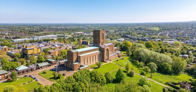 Aerial photo of Guildford Cathedral Church with blue sky in the background