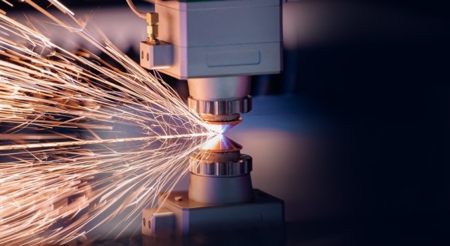 Machinery tool cutting a piece of material