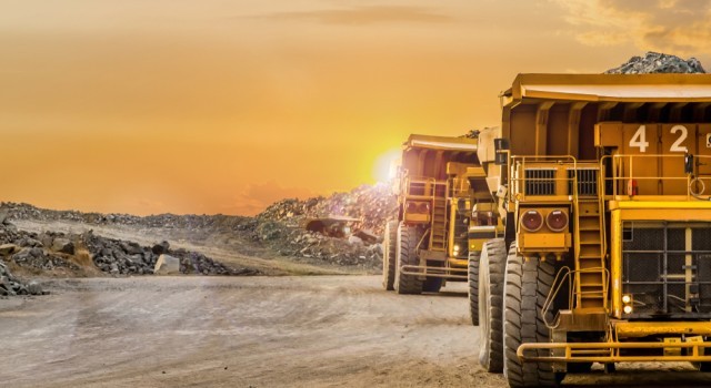 Photo of two dump trucks