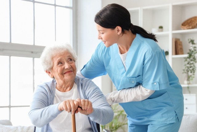 A healthcare specialist looking after an elderly woman