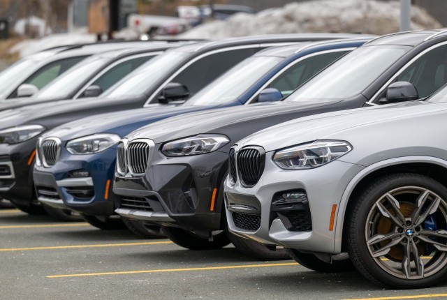 SUV's parked in a line in parking bays