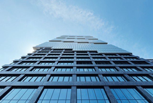 Looking up at a skyscraper in a city centre