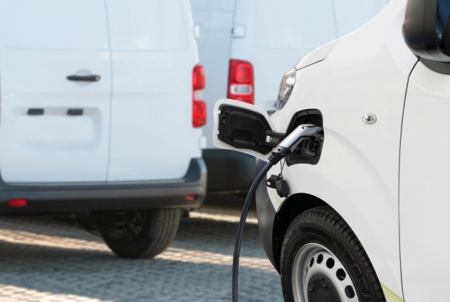 An electric van being recharged at a charging point