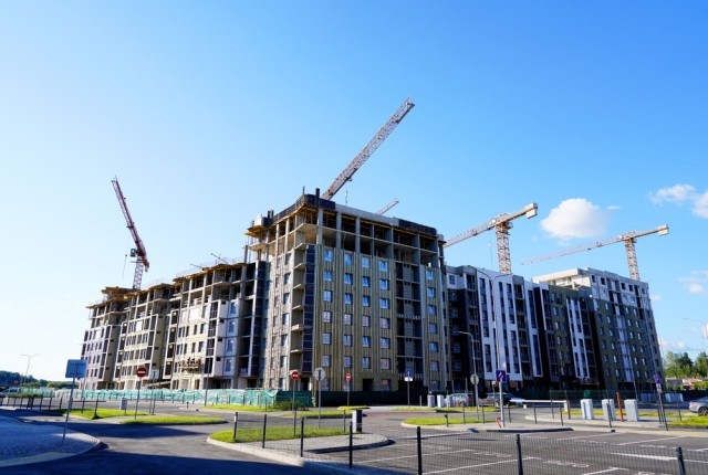 Cranes on a building site constructing residential properties