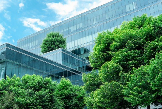 Photo of a new office block with trees around it