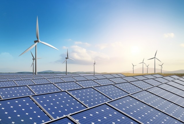 Photo of a wind turbine and a solar panel