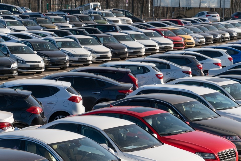 A forecourt of parked cars