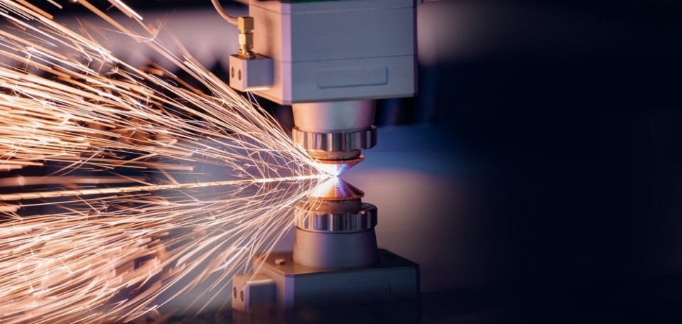 Machinery tool cutting a piece of material